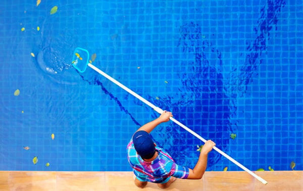 Cleaning the pool - The Process Of Monthly Pool Cleaning 